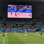 2026 챔피언스 임팩트 대회 완벽 정리 2026 챔피언스 임팩트 무대 전경, 대형 LED 스크린과 관중석, 선수들이 경기에 집중하는 모습